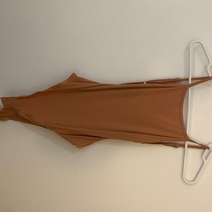 Size large women’s body suit, like new condition. High neck and open back design